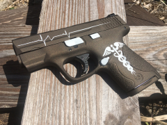 The nurse theme Pistol with Caduceus and Heart Beat