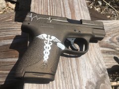 Caduceus and Heart Beat on Pistol